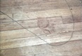 Bloody left footprint of Jeffrey MacDonald, made in Type A blood (the blood type of Colette MacDonald), exiting Kristen MacDonald's bedroom.  After the floor boards containing this print were marked by CID Chemists Craig Chamberlain and Walter Rowe, they were sawed out, but separated upon removal.